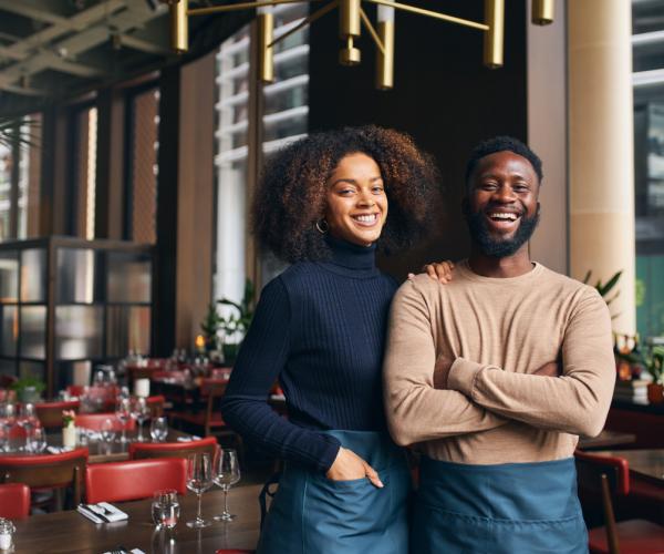 Couple in restaurant smiling