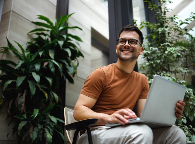 Man in workplace on laptop