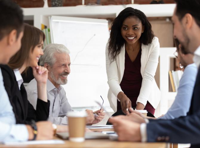 Businesspeople gathered together in a board room