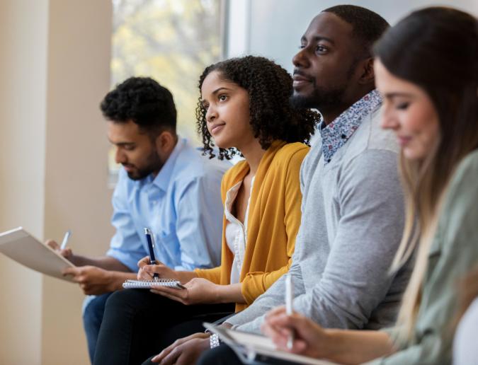 Row of business people in a training class